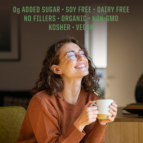 Smiling woman in glasses wearing a brown sweater holding a white mug indoors with wellness benefits text above.