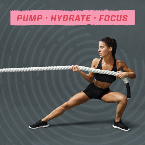 Athletic woman in black workout clothes performing a wide side lunge while gripping a thick rope against a gray patterned background with the words "PUMP · HYDRATE · FOCUS" in pink above her.
