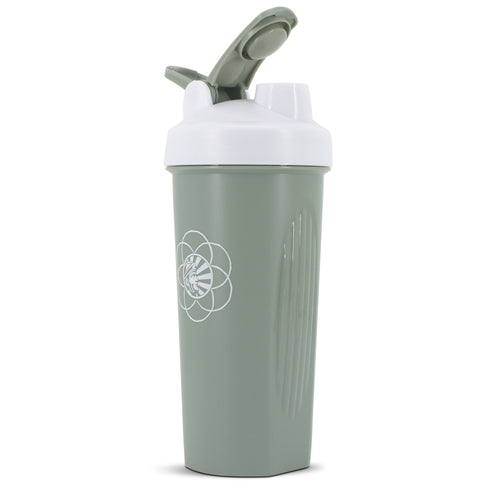 Green shaker bottle with white flip-top lid and geometric sun logo on front